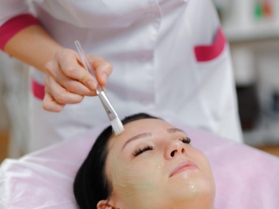 professional woman applying green cream with a brush 1208 313